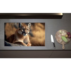 Inductieplaat Beschermer - Cartoon van Puma Liggend op Grijze Rots in Natuurgebied - 85x50 cm - 2 mm Dik - Inductie Beschermer - Bescherming Inductiekookplaat - Kookplaat Beschermer van Wit Vinyl