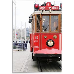 WallClassics - PVC Schuimplaat- Rode Tram door de Stad - 40x60 cm Foto op PVC Schuimplaat