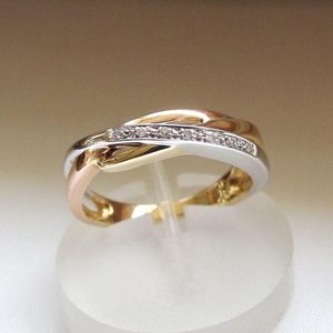 Gouden tricolor ring met diamanten