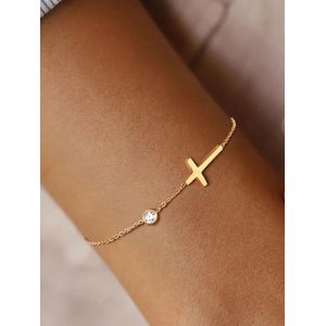 Goudkleurig RVS armband met een kruisje en subtiel steentje, Stainless Steel, goudkleurige armband, dames armbandje, gouden sieraad
