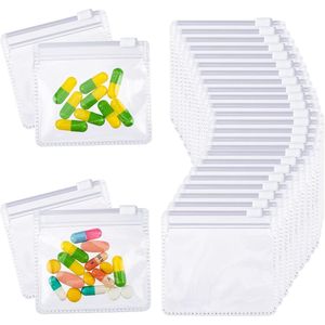 Verpakking van 25 herbruikbare pillen zakjes met ritssluiting - zelfklevende reis organizer met schuifsluiting - helder plastic - voor medicijnen, vitaminen en snuisterijen