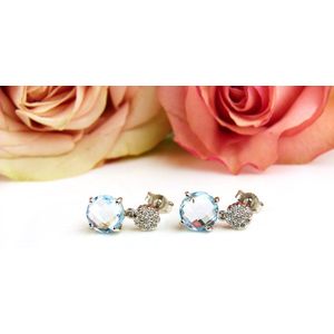 Oorringen in wit goud gezet met blauwe topaas en diamant