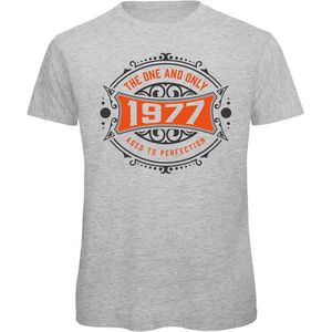1977 The One And Only | Feest Kado T-Shirt Heren - Dames | Antraciet - Oranje | Perfect Verjaardag Cadeau Shirt | Grappige Spreuken - Zinnen - Teksten | Maat L