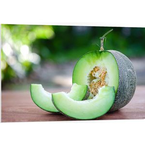PVC Schuimplaat- Halve Meloen met Stukken Meloen - 105x70 cm Foto op PVC Schuimplaat