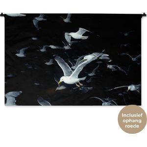 Wandkleed Dieren - Close-up vliegende meeuwen tegen zwarte achtergrond Wandkleed katoen 150x100 cm - Wandtapijt met foto