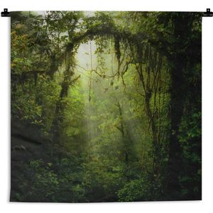 Wandkleed Diep in de jungle - Zonnestralen glippen door het tropische bladerdak Wandkleed katoen 60x60 cm - Wandtapijt met foto