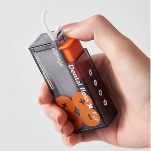 Zwart en oranje - Automatische draagbare flosspickbox - Flosspickdispenser - Navulbare flosspickorganizer - Ruimte voor 10 flosspicks - Gemakkelijk mee te nemen - Gebruikt een knop om er één tegelijk uit te werpen