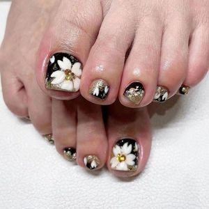 Allecto Plus - Set van 24 stuks zwarte nep teennagels met witte bloemen en strass pailletten | Valse teennagels pers op voor vrouwen en meisjes
