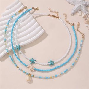 Sorprese Ketting Dames - Mare - Azure Coast - 3-Laags Kralenketting - Turquoise/Wit/Goud - Schelp & Zeester Hanger - Bohemian & Zomers - Model V