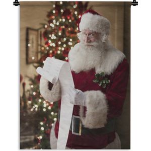 Wandkleed Kerst - De leeslijst van de kerstman met op de achtergrond een kerstboom Wandkleed katoen 120x160 cm - Wandtapijt met foto XXL / Groot formaat!