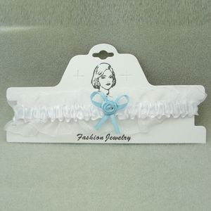 Kousenband wit organza met blauw strikje