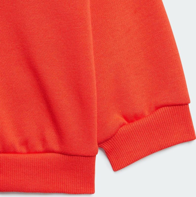 Joggingset in molton ADIDAS SPORTSWEAR. Geruwd molton materiaal. Maten 12/18 mnd - 74/81 cm. Rood kleur