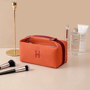Eenvoudige waterdichte canvas make-uptas Mode-organiser Oranje make-uptas Dames make-up organisator Reistoilettas