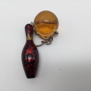 Bowling Bowling sleutelhanger 'Combi pin en bal massief'  donker rood  en doorzichtig geel
