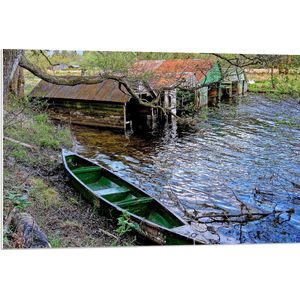 WallClassics - PVC Schuimplaat- Groene Kano bij Water - 90x60 cm Foto op PVC Schuimplaat