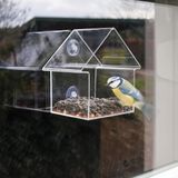 <p>Wilt u graag weten wat er zich afspeelt in een vogelvoederhuisje? Dan is dit moderne acryl voederhuisje van Esschert design perfect voor u. Met zijn doorzichtige muren en dak kunt u alles wat er binnen gebeurt gemakkelijk observeren.</p>
<p>Het voederhuisje kan eenvoudig op het raam worden geplaatst dankzij de 2 zuignappen. Het transparante materiaal zorgt ervoor dat u kunt genieten van het schouwspel van vogels die van het eten genieten. Bovendien is het materiaal makkelijk schoon te maken.</p>
<p>Dit voederhuisje wordt geleverd in een cadeauverpakking en bevat 2 zuignappen voor bevestiging op een raam of muur. Let op: vogelvoer is niet inbegrepen.</p>
<ul>
  <li>Kleur: doorzichtig</li>
  <li>Materiaal: PMMA en PVC</li>
  <li>Afmetingen: 15 x 10 x 15,3 cm (L x B x H)</li>
  <li>Inclusief 2 zuignappen voor bevestiging op een raam</li>
  <li>Eenvoudig te reinigen</li>
  <li>Voer is niet inbegrepen</li>
</ul>