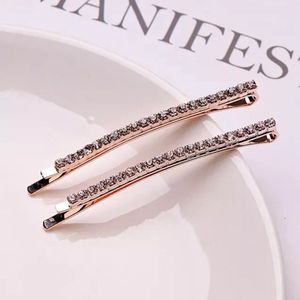 Dames haarspeld/haarklem - schuifspeld - goud strass stenen - set van 2 - feest/bruiloft haaraccessoires