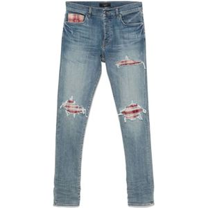 Amiri, Jeans, Heren, Blauw, W31, Lichtblauwe Ripped Jeans met knoopsluiting